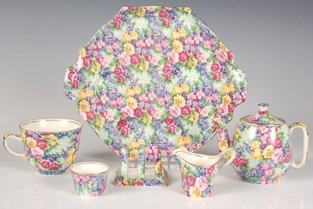 ROYAL WINTON 'JULIA' PATTERN CHINTZ BREAKFAST SET: The base plate measures 8.5 x 10.25, teapot measures 4.25 x 5 inches, tea cup measures 2.5 x 4.25 inches, toast rack measures 1.75 x 2.75 inches, creamer measures 2.5 x 3.25 inches and the sugar measu