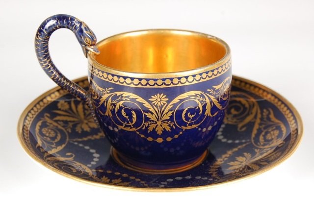 MEISSEN COBALT GROUND CABINET CUP WITH SAUCER: The cup measures 3.25 x 3.75 inches and saucer measures 5.75 inches. Blue mark under glaze.