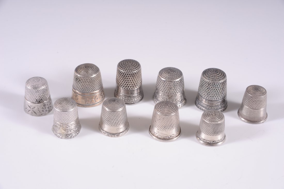 NINE STERLING SILVER THIMBLES: Weighs 1.15 ozt.