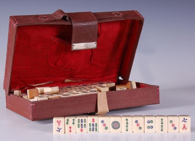 BOXED MAH JONGG GAME: One hundred thirty six bone and bamboo tiles that measure 1 x .75 inches each including three dice, with an overall boxed measurement of 6.5 x 10.25 inches.