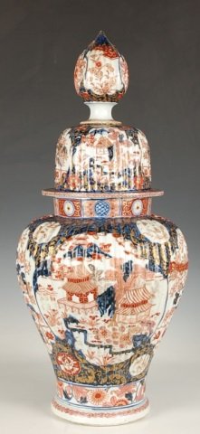 19TH C. IMARI WARE FLOOR VASE WITH COVER: Damage to the finial of the cover and roughness at the rim. Measures 26.5 x 11.5 inches.