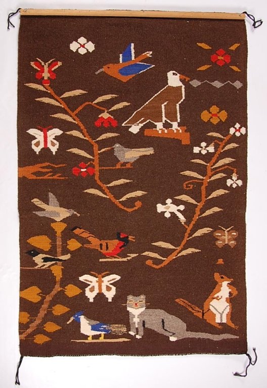 NAVAJO TREE OF LIFE PICTORIAL WEAVING.: With an original tag that reads Teec Nos Pos Arizona Trading Post, Russell Foutz Indian Room, weaver Ireen Notoh. Measures 51 x 37 inches.