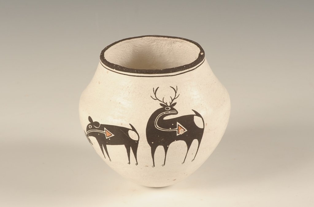 LUCY & EMMA LEWIS ACOMA SMALL POTTERY OLLA: Signed under the vase, a design of heart line deer. Measures 4 x 4.5 inches.