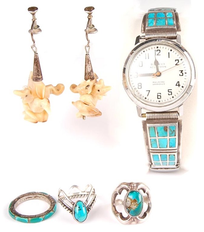 BULOVA ACCUTRON WITH ZUNI BAND & OTHER INDIAN JEWELRY: A vintage Bulova Accutron with Zuni inlaid band along with pair of carved fossil walrus ivory earrings, and three silver and turquoise rings each 5 to 5.5 size rings.