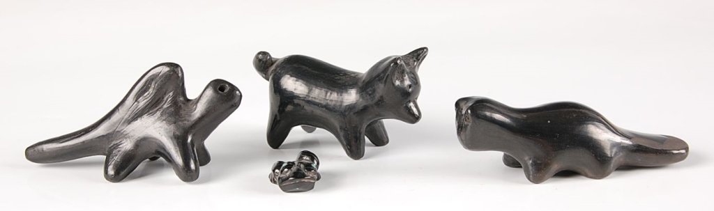 THREE SANTA CLARA POTTERY ANIMAL FIGURES: Beaver, dog and dinosaur pottery figures along with a carved frog with inset turquoise eyes. Size range from 3.25 down to 1 inches.