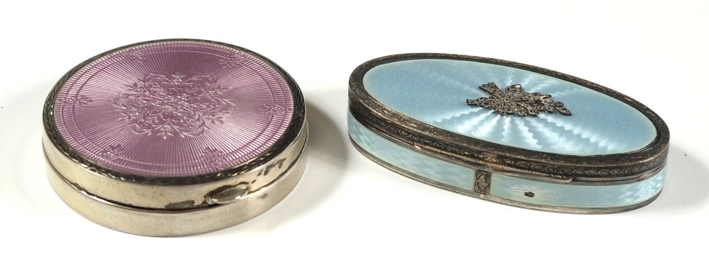 TWO STERLING SILVER ENAMEL BOXES: Each marked .925, the oval Guilloche enamel piece with marcasite's has a small chip on the front side. Pink circle compact measures 2.5 inches in diameter, and blue oval compact measures 1.5 x 3.5 inc
