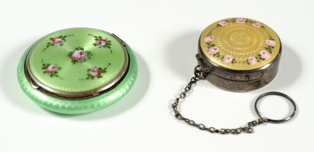 NICE GUILLOCHE COMPACTS INCLUDING STERLING SILVER: The yellow example with sterling silver markings and the other signed Marthon. Compact green in color measures 2.25 inches in diameter, and the yellow compact measures 1.5 inches in diameter.