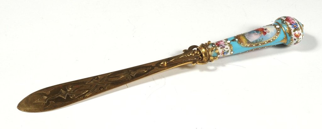 LATE 19TH C. PORCELAIN HANDLE LETTER OPENER MINIATURE: Continental porcelain with beaded enamels, gold highlights, and hand painted florals surrounding two oval reserves containing hand painted images of courting nobles in 18th century dress. Measures 10 