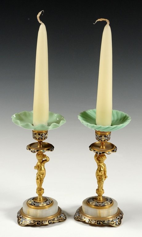 PAIR CHAMPLEVÉ ENAMEL CHERUB FIGURAL CANDLESTICKS: Ormolu candlesticks with champlevé enameling and a figural cherub stem on marble base. Pair measures 6.25 x 3 inches each.