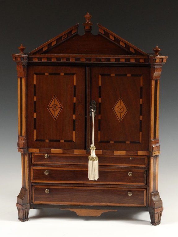 19TH C. MINIATURE BIEDERMEIER LINEN PRESS WITH INLAY: A detailed miniature linen press with two inlaid doors over three drawers flanked by mixed wood flat columns. Nice detail and cute size at 18 inches high x 14 inches wide and 5 inches deep. Complete w