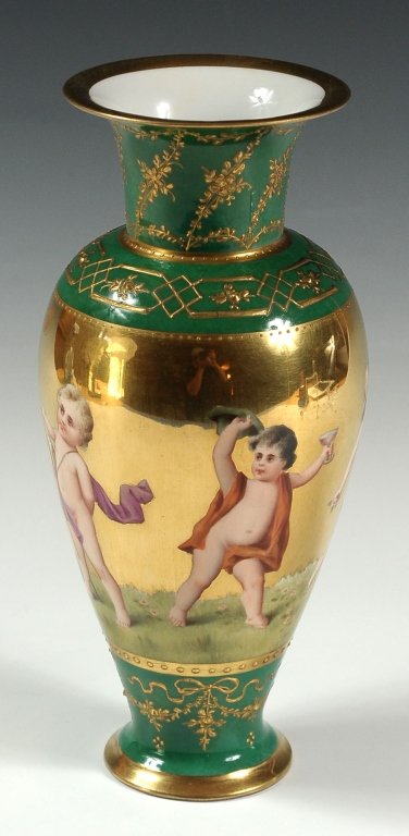 FINE KPM PORCELAIN VASE WITH HAND PAINTED CHILDREN: Central band of heavy gold with painted images of children and cherub in various activities. Raised gold enamels above and below on a green background. The base marked with blue sceptre mark under the