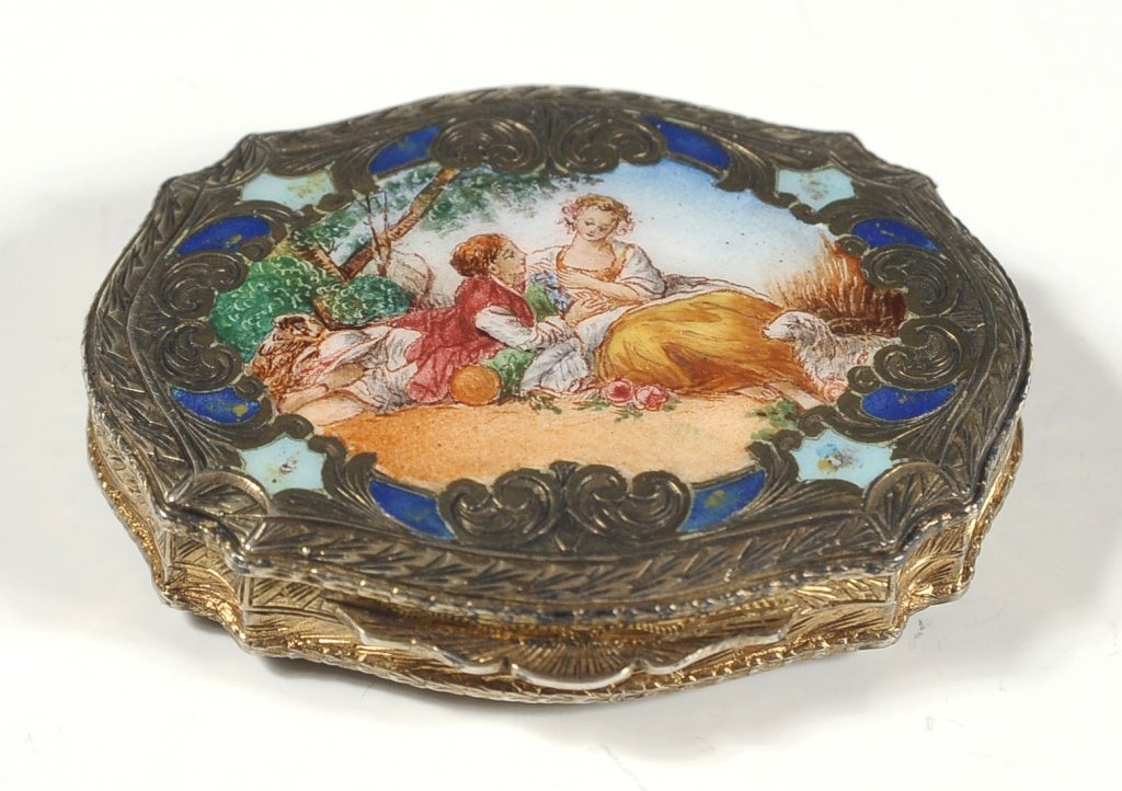 NICE ITALIAN ENAMELED PARCEL GUILT COMPACT: Fine enameling and engraving on the exterior, interior with beveled mirror and compartment. Measures .5 x 2.75 x 2.25 inches.