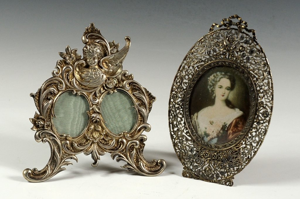 TWO NICE 20TH C. EASEL BACK PICTURE FRAMES: Cherub and another. Two framed pieces, with one including an image measuring 6.5 x 4 inches, and the image measures 3 x 2.25 inches, and the other frame measures approximately 6.25 x 5.5 inches.