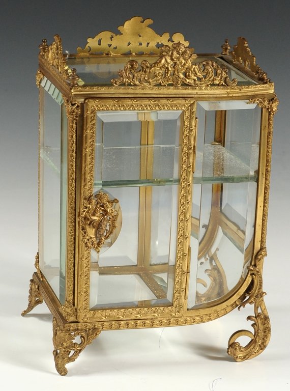 FRENCHH ORMOLU AND BEVELED GLASS SEDAN CHAIR FORM: Nice quality ormolu casting with beveled glass panels on all sides, top and bottom including the curved base. Fine quality. Measures 10.25 x 7 x 4.5 inches.