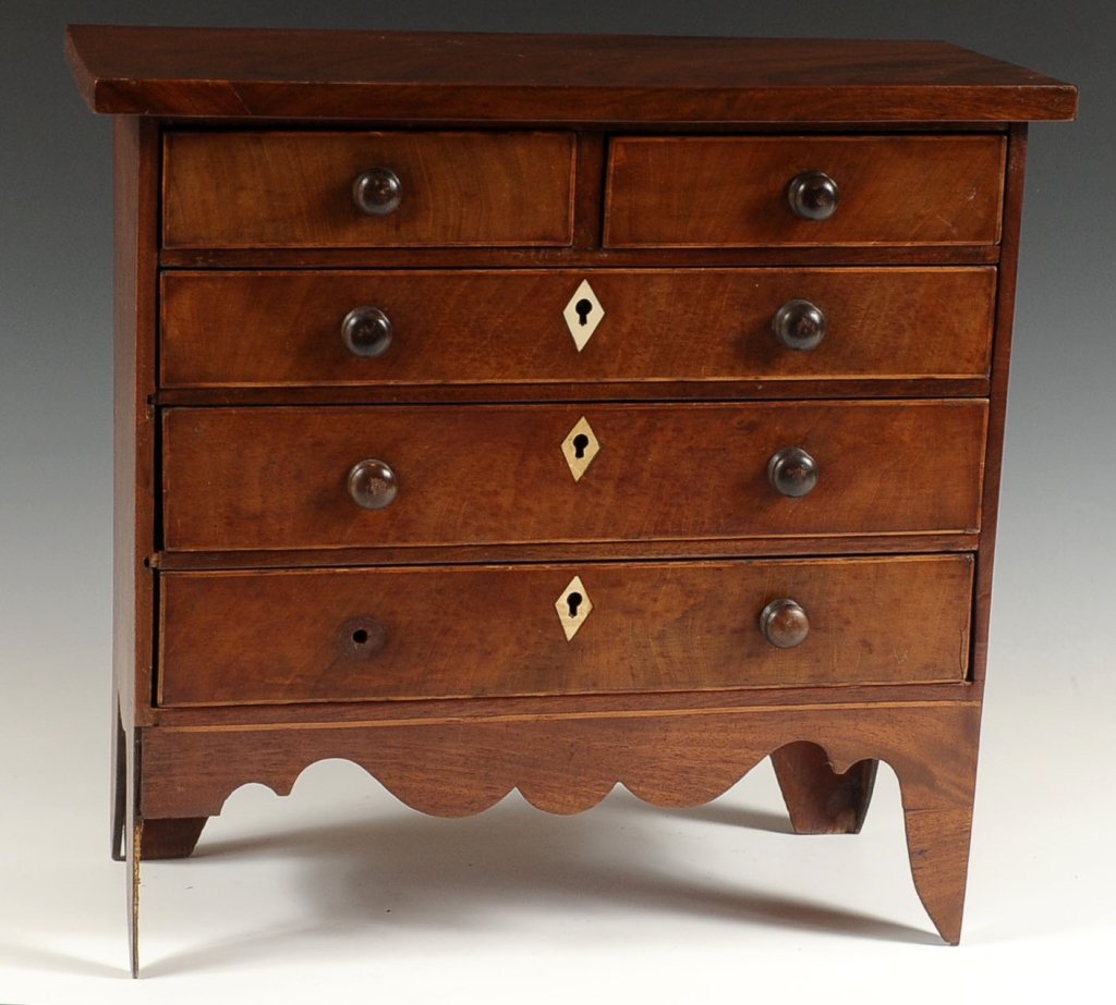 MINIATURE 19TH C. MAHOGANY FIVE DRAWER CHEST: With ivory escutcheons and drawers that have string inlay, mahogany woods with oak secondary wood. English circa 1830's. Measures 13.25 high x 15.5 wide x 6.5 deep. NO INTERNATIONAL SHIPPING.