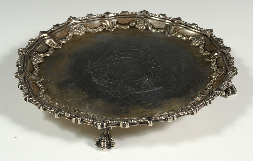EDWARDIAN STERLING SIVER FOOTED SALVER: With hallmarks and makers name of Goldsmiths, and Silversmiths Company Ltd. Measures 1 x 8 inches in diameter.