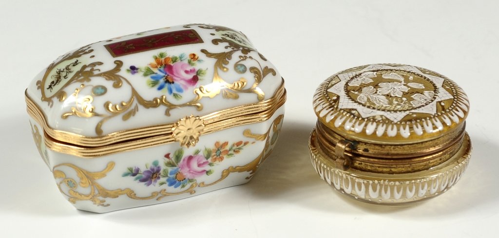 TWO SMALL GLASS AND PORCELAIN BOXES: 20th century hand painted French porcelain box, and a Victorian enameled glass ring box. Two pieces, with one smaller piece that measures 1.25 x 2 inches in diameter, and the larger piece that measure