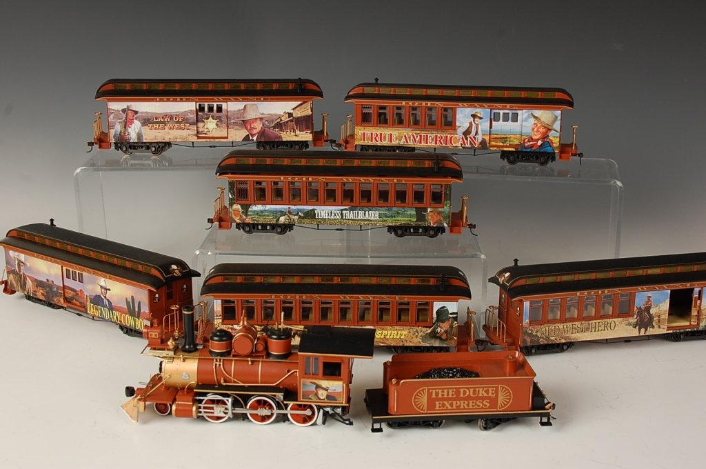 HAWTHORNE VILLAGE THE DUKE EXPRESS SET WITH TRACK: Includes locomotive, tender, Old West Hero, True American, Untamed Spirit, Legendary Cowboy, Law of the West, Timeless Trailblazer cars. Unused sets of track and Tyco power box. Appears unusued and in
