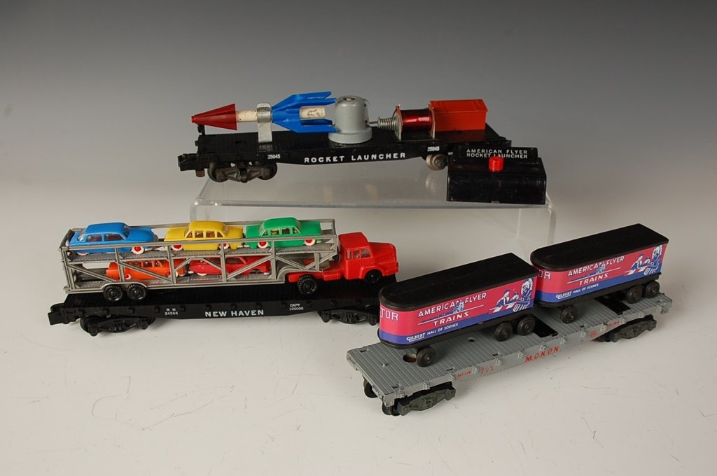 AMERICAN FLYER ROLLING STOCK 24566, 956, 25045: Post-war S gauge, includes 24566 New Haven with truck and five cars - one car missing front wheels; 956 Monon with AF Trains trailers, and 25045 rocket with launcher control. Average - all show cosmet