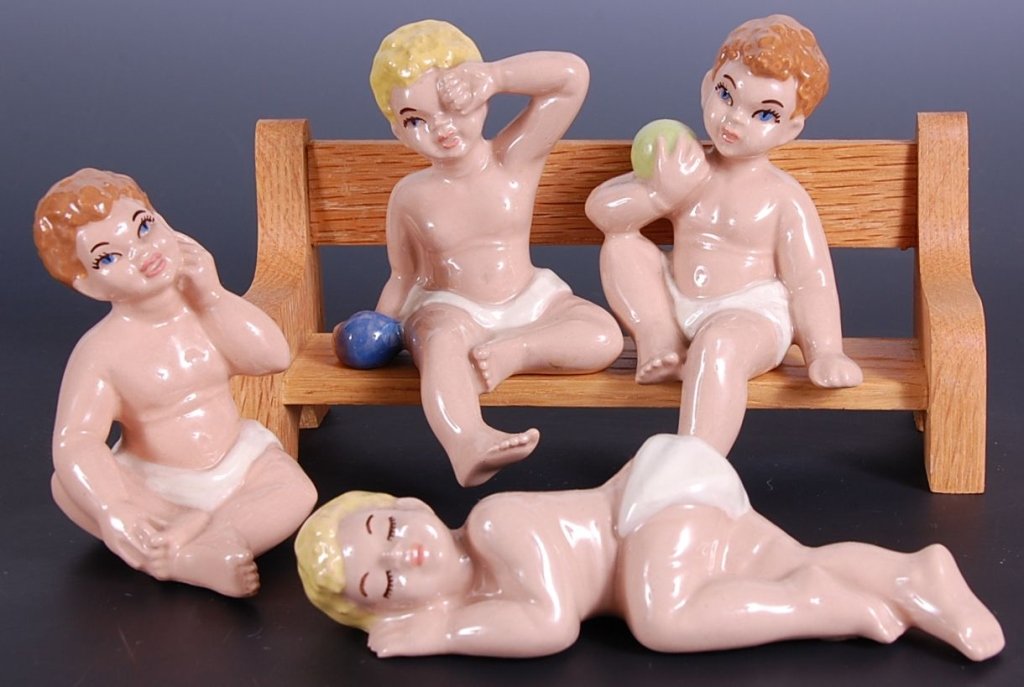 CERAMIC ARTS STUDIO WHITE BABIES: Woody sitting measures 3 inches. Winney lying down measures 5.5 inches across. Wally shelf sitter with green ball measures 4 inches. And Willy with blue ball measures 4 inches.