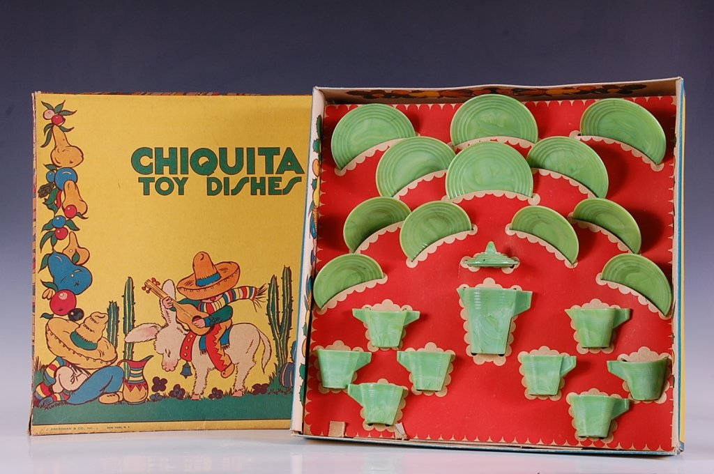 CHIQUITA TOY JADITE DISHES IN ORIGINAL BOX: Circa 1940 by J. Pressman Co. Inc. Jadite green glass dishes with service for six with plates, cups, saucers, lidded pitcher, creamer & sugar. Plates measure 3.75 inches, pitcher with lid 3.75 inches.