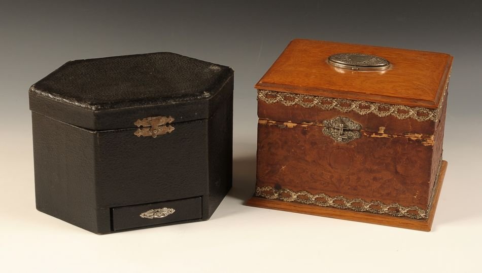 TWO ANTIQUE COLLAR BOXES: Two pieces with one black in color that measures 6.25 x 9.75 x 7 inches, and the piece brown in color measures 6.25 x 8.75 x 7.5 inches.