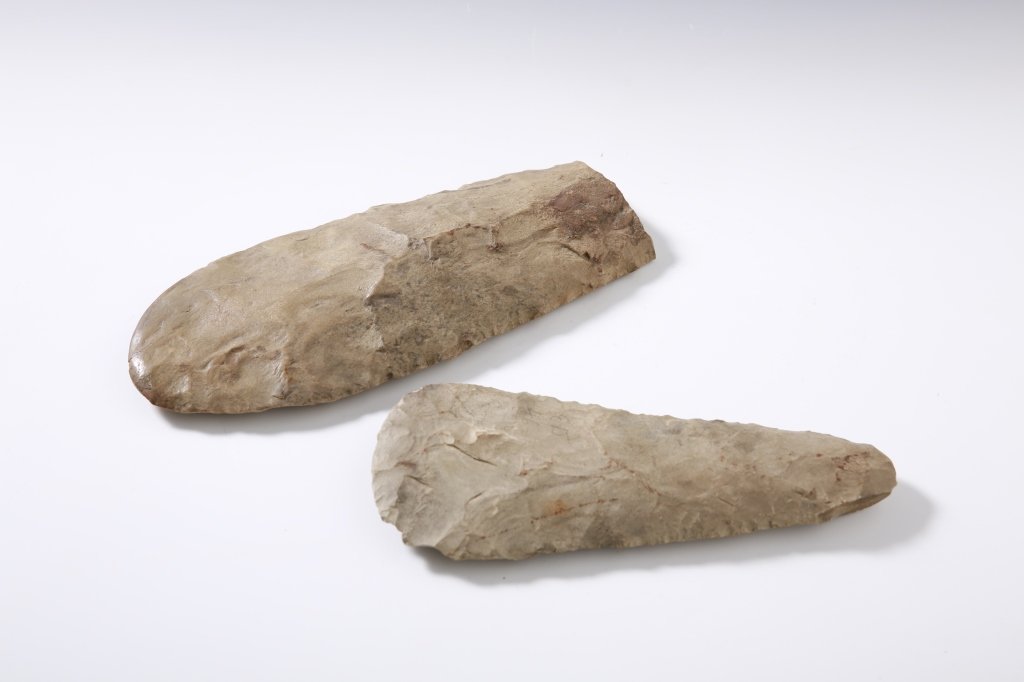TWO LARGE CHIPPED STONE BLADES: Measures 11 and 9 inches long, polished wear on the larger.