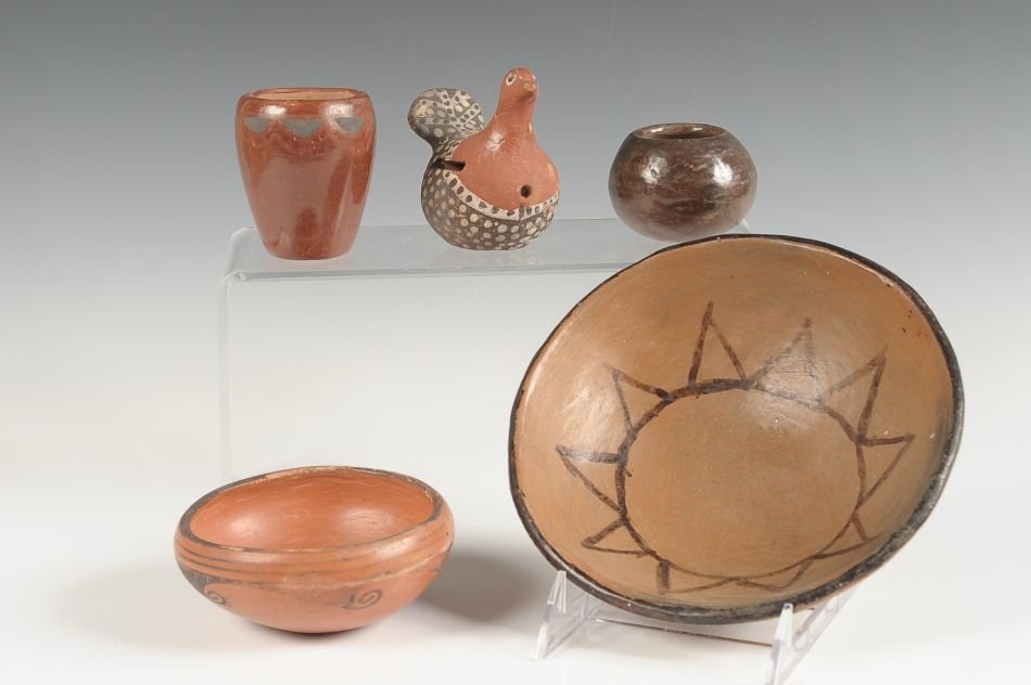 PAPAGO HOPI ISLETA AND OTHER POTTERY, 4 PIECES: Including a 2 x 7.5 inch Papago bowl with sun painting in the center. A 2 x 4 inch bowl, a san Juan jar 3 inches high, and a Santa Domingo jar 2 inches.