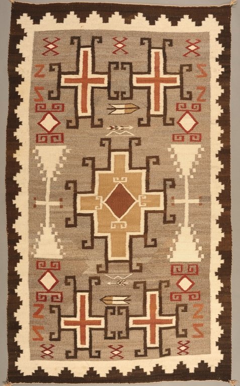 NAVAJO WEAVING WITH FLOATING CROSSES AND HOOKED DESIGNS: Nice weaving filled with complex designs, circa 1940s. Measures 77 x 48 inches.