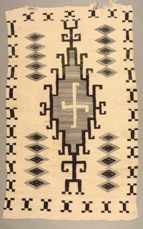 NAVAJO WEAVING WITH WHIRLING LOG, HOOK AND DIAMOND: Circa 1930s. Measures 72 x 42 inches.