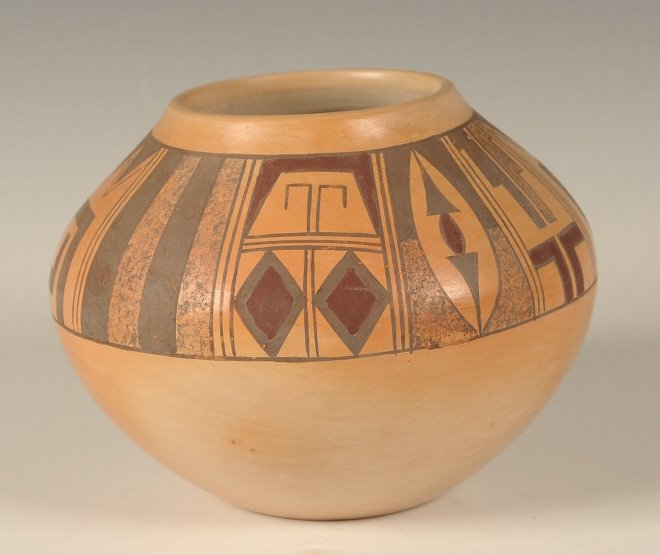 L. NAMINGHA HOPI POTTERY JAR: Signed under the base, a member of the Nampeyo family as outlined on the facsimile found in the jar. Black and red geometric designs on buff colored ground. Measures 4 x5 inches.