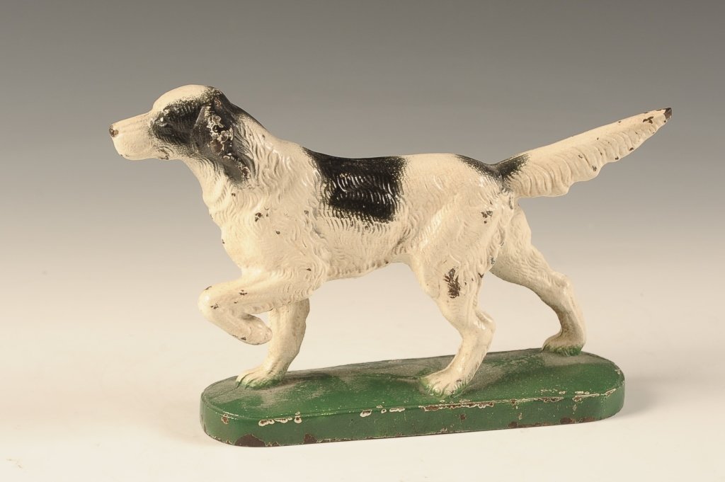 EARLY 20TH CENTURY CAST IRON SETTER DOG DOORSTOP: With nice original paint. Overall measurements of 6 x 2.25 x 1.75 inches.