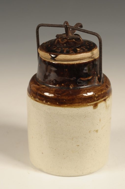 SMALLEST SIZE WEIR POTTERY STONEWARE CANNING JAR: Embossed lettering on the cover and date of '02. Measures 4.5 x 2.75 inches.