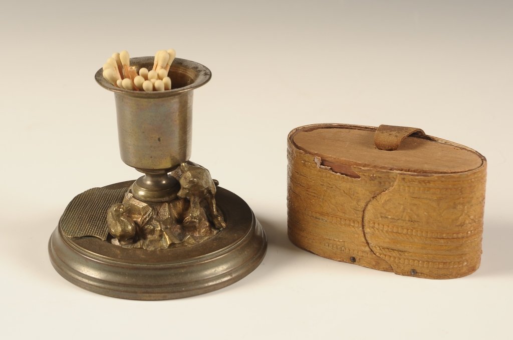 ANTIQUE MATCH STRIKER & BIRCH BARK SNUFF BOX WITH: Fox match striker measures 3 x 3.5 and the Birch bark box with leather pull measures 1.75 x 3 x 1.5 inches.