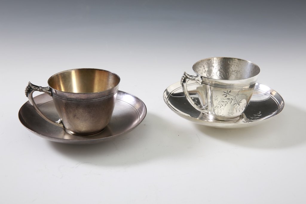 TWO VICTORIAN SILVER PLATED CUP SAUCER SETS SIGNED: Two sets one cup measures 3 x 4.25 inches and saucer measures 5.75 inches in diameter, and the other cup measures 2.5 x 3.25 inches and saucer measures 5.25 inches in diameter.