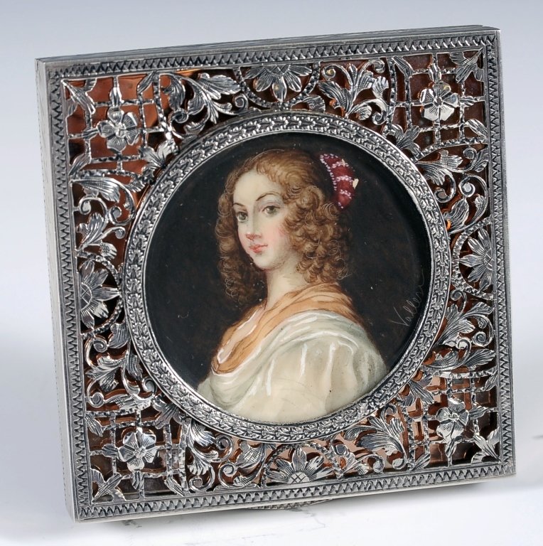 SILVER MINIATURE PORTRAIT COMPACT SIGNED 'VALLES': Hand-painted miniature portrait signed 'Valles' surrounded by silver filigree over gold foil, beveled mirror, marked .800 in the powder well, elaborate chased silver back, measures 3 x 3 x .5 inches.