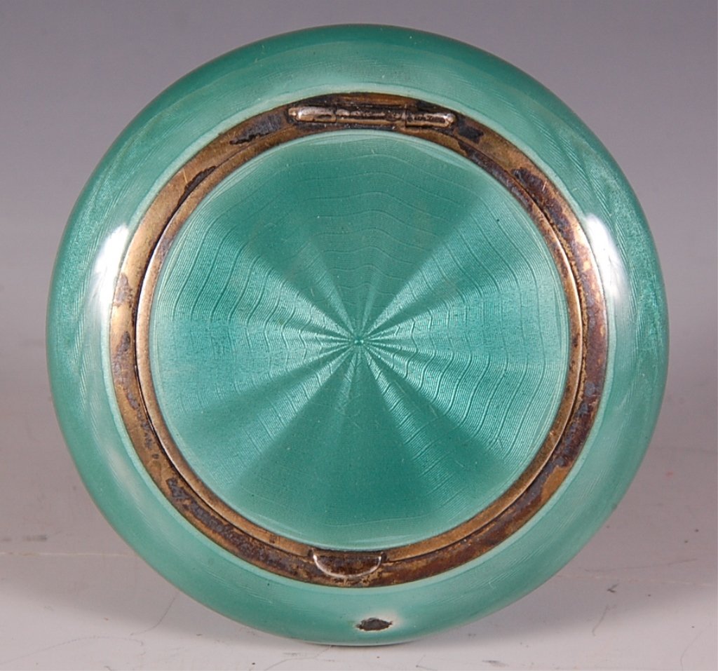 STERLING AND GREEN GUILLOCHE COMPACT: Guilloche compact with white enamel interior, marked on the inside lid, measures 2.5 inches.