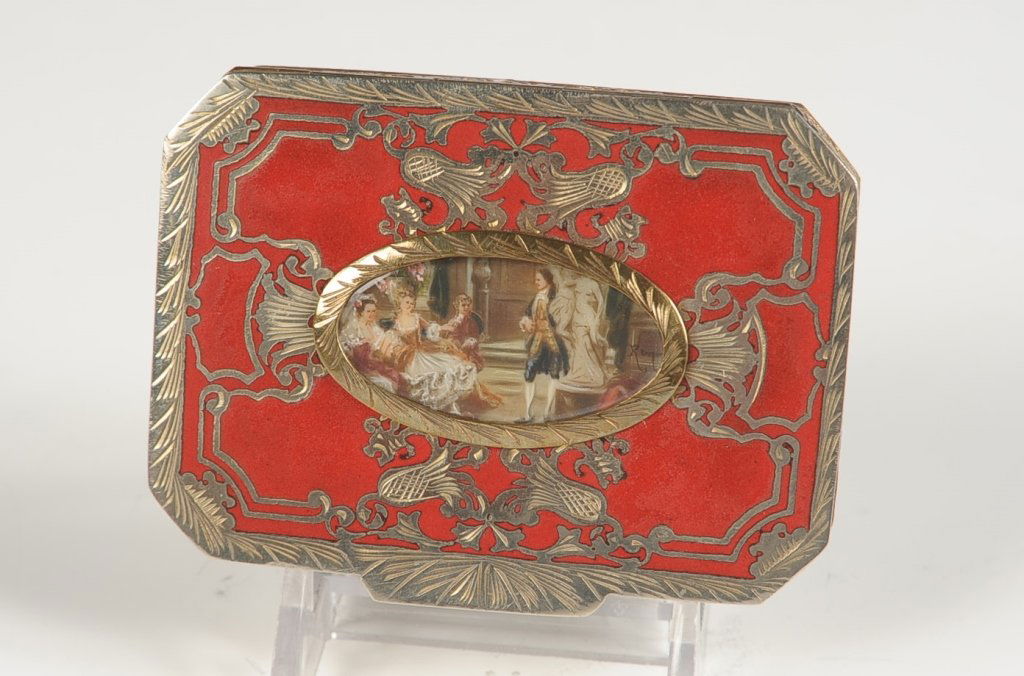 CHAMPLEVE ENAMEL COMPACT W A MINIATURE UNDER GLASS: Red champlev Ã© enamel top with an oval miniature painting under glass in the center, embossed base, framed mirror in the lid, marked in the powder well, Italy, measures 2.5 x 3.25 inches.