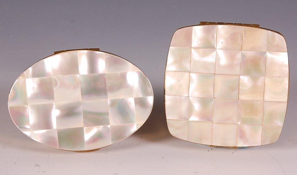 MELISSA & MARHILL COMPACTS WITH MOTHER-OF-PEARL: Melissa goldtone compact with a mother-of-pearl top, mirror in the lid, powder well with a hinged lid, mesh sifter and branded puff, marked on the powder well lid, measures 2.5 x 2.5 inches, good. Plu