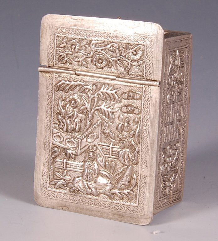 CHINESE EXPORT SILVER COMPACT VANITY CASE: Repousse' silver compact with Asian designs, a hinged stand up mirror and a pull out drawer with mesh sifter and puff, marked 'Silver 840' on the bottom, monogrammed in three places, measures 2.75 x 2