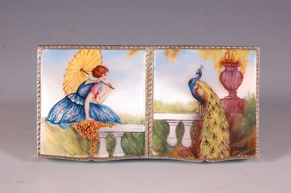 ENAMEL & GUILLOCHE STERLING COMPACT W PEACOCK: Hand-painted scenes of a woman and a peacock on a sterling compact with guilloche, etched on the bottom 'Betty Fueger Milwaukee', two lidded compartment each with a mirror, left side has a Elgin Ameri