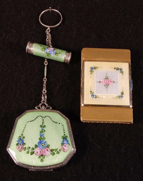 TWO LA MODE GUILLOCHE COMPACTS, ONE IN STERLING: Sterling & green guilloche compact with chain handle, finger ring and lipstick & perfume fob, hand-painted florals in the compact and fob, mirror in the lid, rouge well in the base over a rotary powde