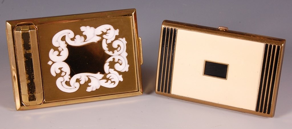 CORO & RICHARD HUDNUT COMPACTS: Black and cream enamel duo compact by Coro with a mirrored lid, rouge well with a pan and branded puff, powder well with a hinged lid and branded puff, marked on the powder well lid, measures 2 x 3 in