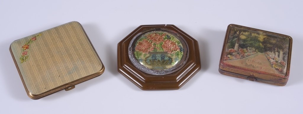 VASHE COMPACT, PLUS PETIT POINT & SOUVENIR COMPACTS: Vashe goldtone duo compact with painted finish and flower decal on the top, mirror in the lid, hinged rouge well with pans for rouge and lip rouge and one puff, hinged powder well with puff, marked on