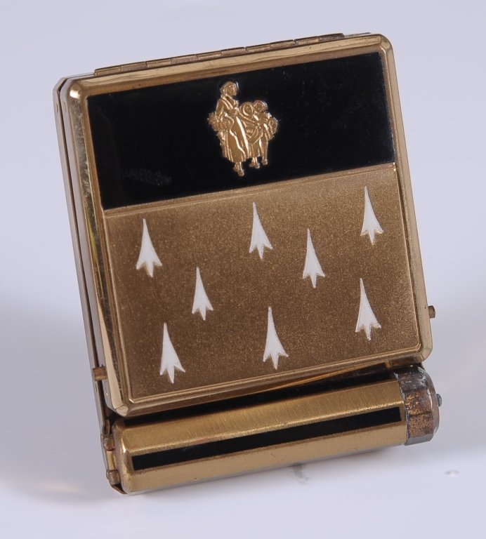 1931 YARDLEY ENAMELED VANITY CASE: Yardley goldtone vanity case with black and white enamel, hinged lipstick, double-sided hinged mirror over a rouge well with pan and puff in the lid, hinged powder well in the base with puff, marked o