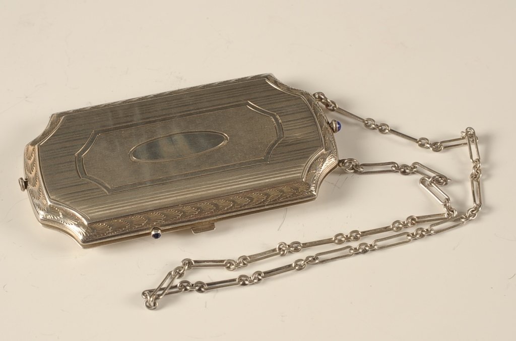 BLISS STERLING VANITY CASE: Chain handle, framed mirror on one side, three hinged wells on the other, marked on the center well lid, measures 3.25 x 1.75 inches with 6 inch drop from the handle, weighs 2.6 ozt.