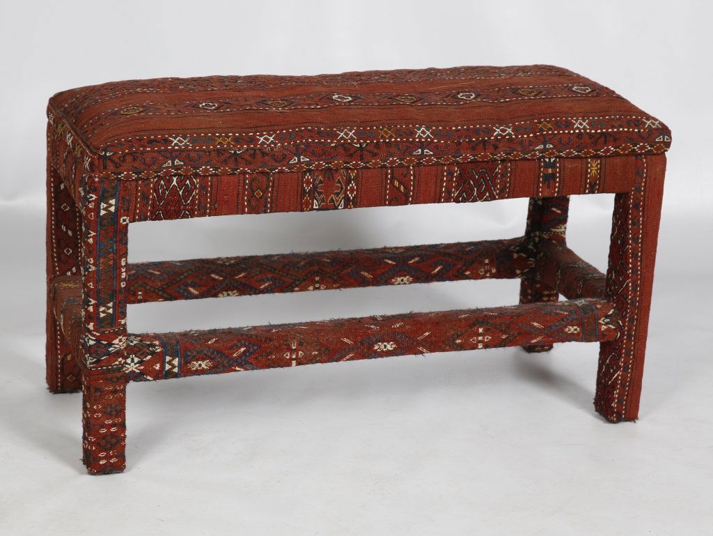 PADDED BENCH UPHOLSTERED WITH AFGHAN KILIM: Circa third quarter of the 20th century, measures 20 x 35 x 14 inches.