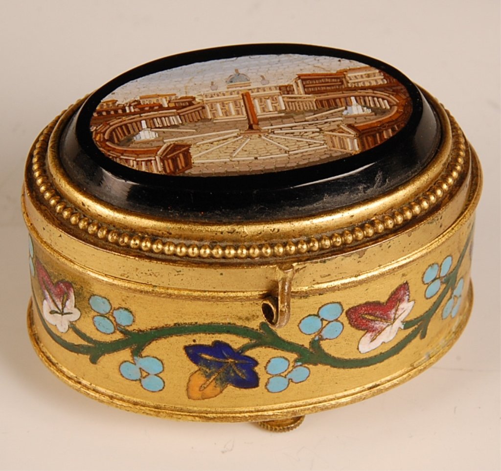 A GILT METAL AND ENAMEL BOX SET WITH MICROMOSAIC PLAQUE: A very fine example depicting St. Peter's Square, gilt metal box with multicolored enamel decoration, raised on four feet. Measures 1.5 x 2.5 x 2 inches.