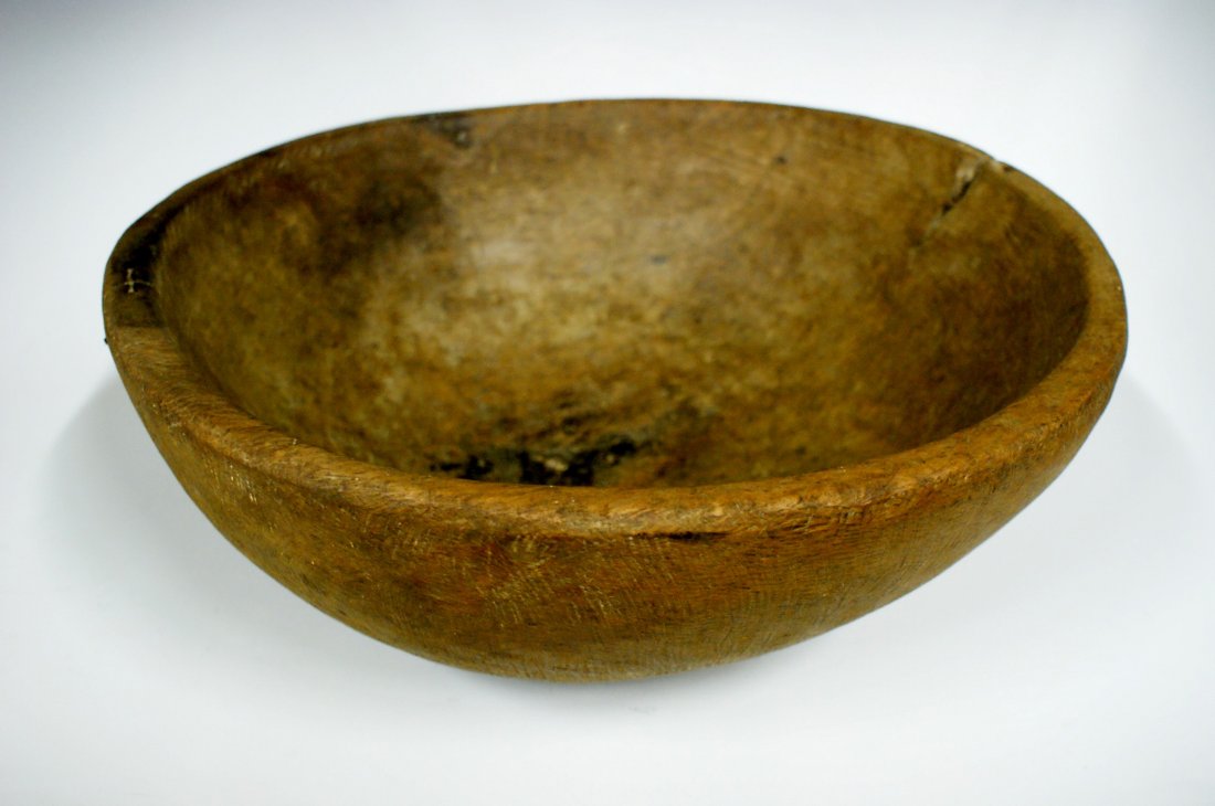 NICE LARGE 19TH CENTURY BURL WOOD BOWL: A great example with nice patina and the visual evidence of having been carved and hacked from a burl growth. There are two splits that have been reinforced with old wire staples. Measures 5.5 inches 