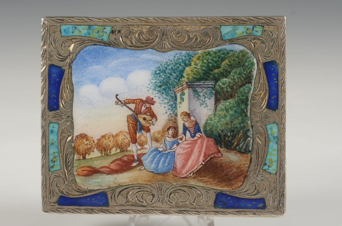 CHASED .800 SILVER COMPACT W ENAMEL COURTING SCENE: Enamel top with a hand painted courting scene, spring loaded lipstick acts as a clasp, framed mirror in the lid, marked .800 in the base, measures 2 x 2.25 inches, weighs 3.75 ozt.